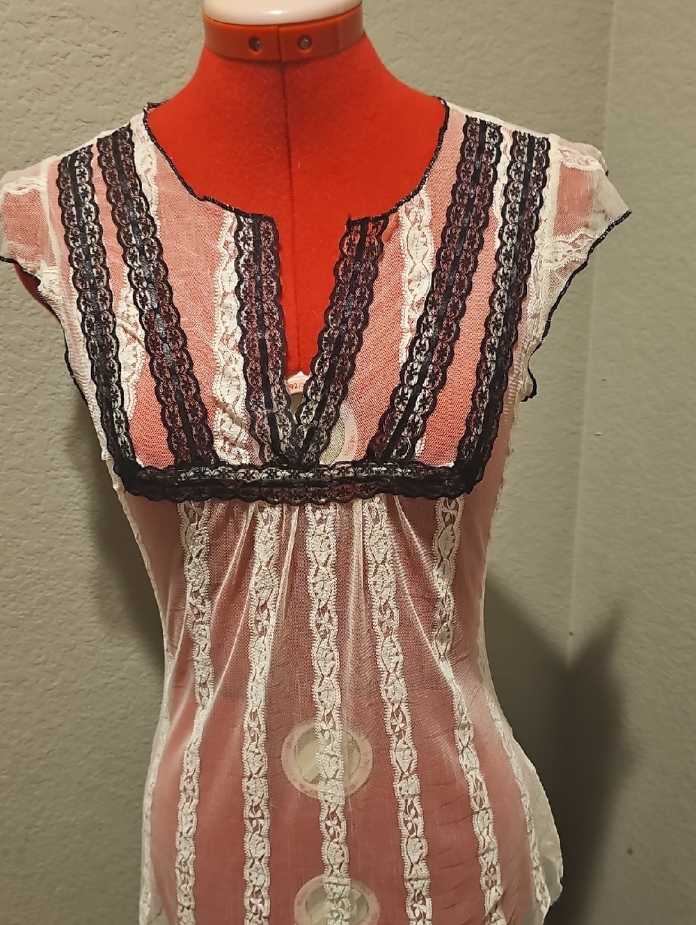 Sheer Lace-Trim Cream Top with Black Accents And Stitching